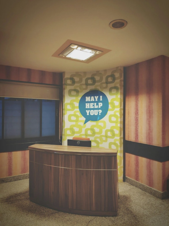 Image of receptionist offering help